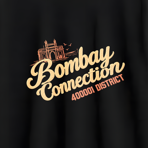A black short-sleeve crewneck t-shirt hanging on a wooden hanger against a light gray wall. The shirt features a graphic print on the chest with a stylized orange train illustration and the text 'Bombay Connection' in a beige script, with '400012 DISTRICT' printed below in orange.