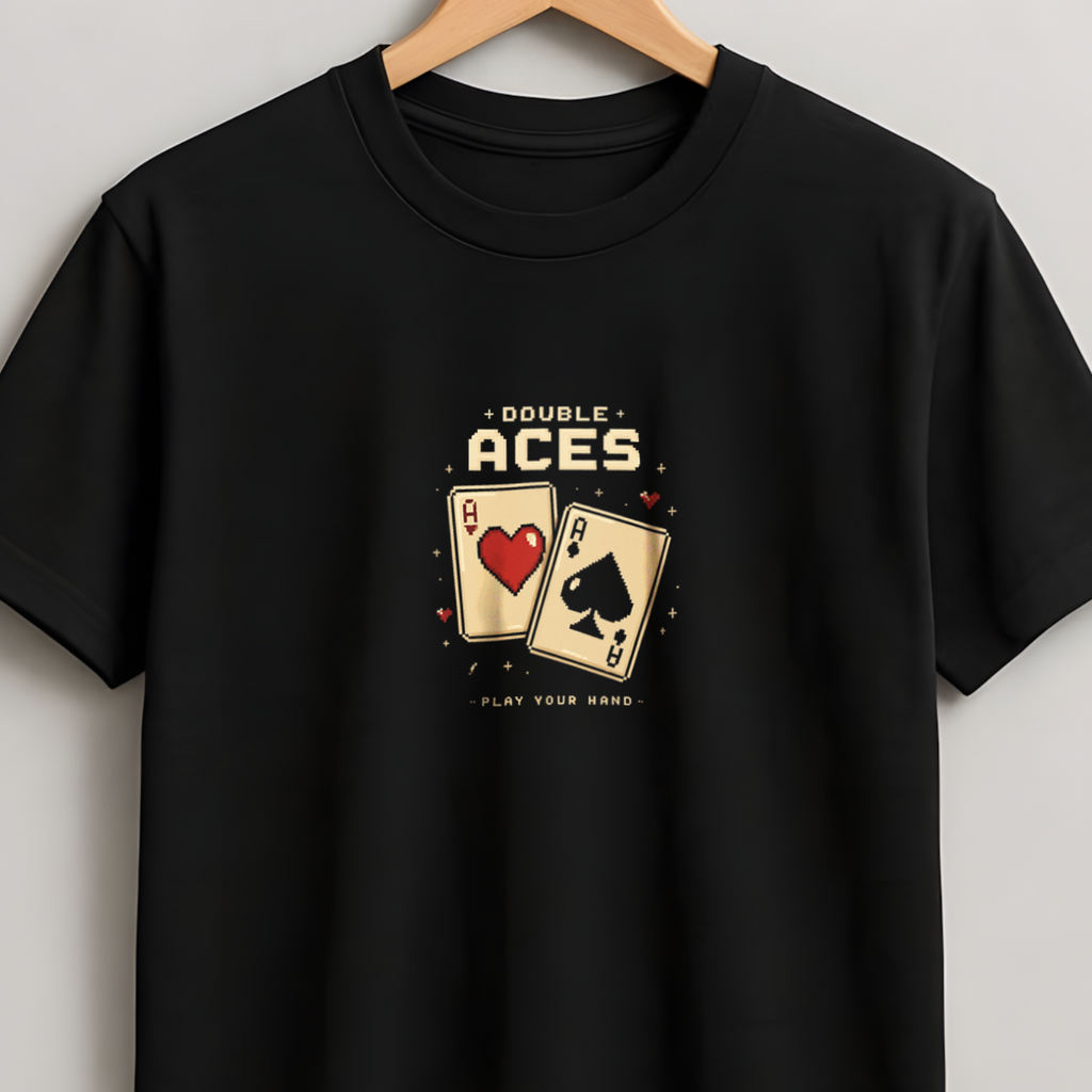 A black short-sleeve crewneck t-shirt hanging on a wooden hanger against a light gray wall. The shirt features a graphic print on the chest depicting two playing cards, an Ace of Hearts and an Ace of Spades, with the text 'A BUNCH OF ACES' above and 'PLAY BACK GAME' below.