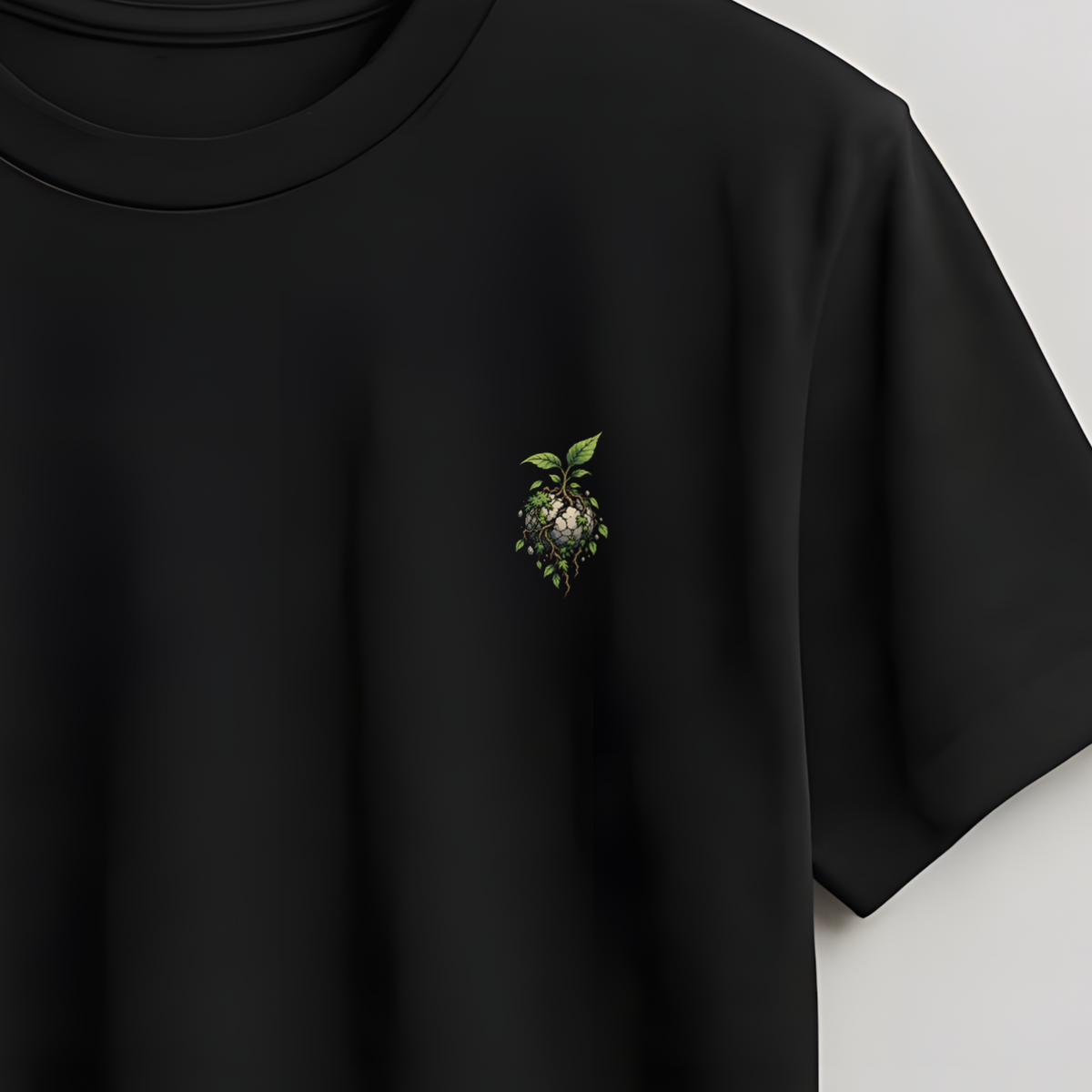 Black t-shirt on a wooden hanger against a light gray background