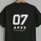 A black short-sleeve t-shirt hanging on a wooden hanger against a solid gray background. The back of the shirt features a large white graphic print with the number '07' and the brand name 'APEX'.