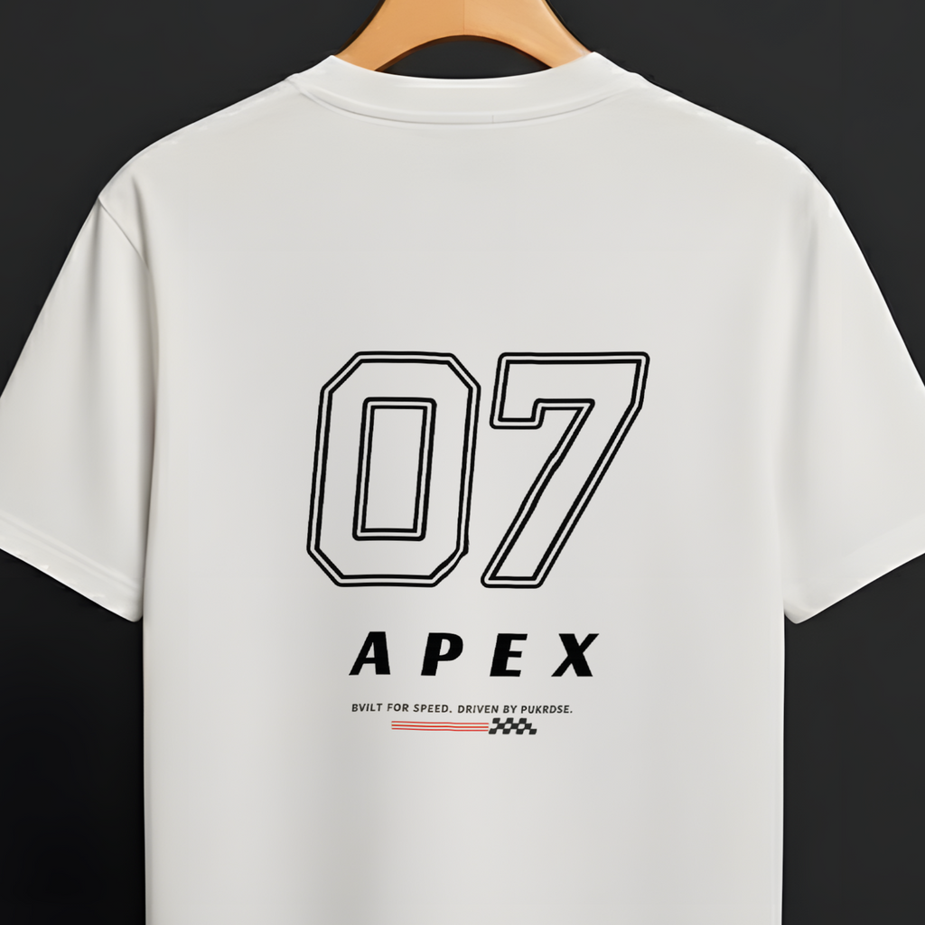 A white short-sleeve t-shirt hanging on a wooden hanger against a dark background. The back of the shirt features a large black outlined '07' graphic above the word 'APEX' in black, with small red and black text and logo details underneath.