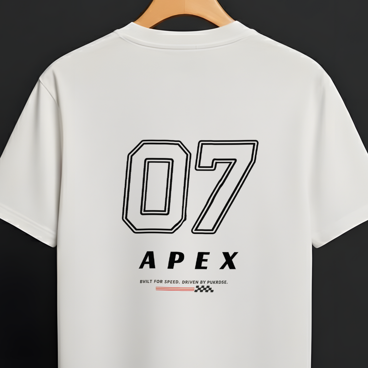 A white short-sleeve t-shirt hanging on a wooden hanger against a dark background. The back of the shirt features a large black outlined '07' graphic above the word 'APEX' in black, with small red and black text and logo details underneath.