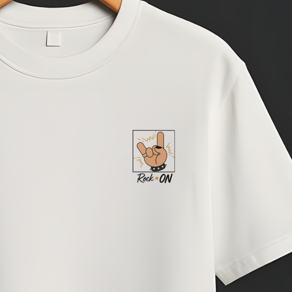 A white short-sleeve crewneck t-shirt hanging on a wooden hanger from a black clothing rack, featuring a small graphic print on the left chest with a cartoon dog and the text 'Dog GO!'.
