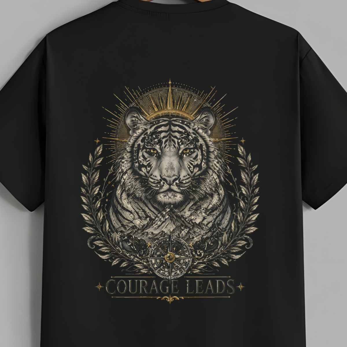 Black t-shirt on a hanger against a gray background